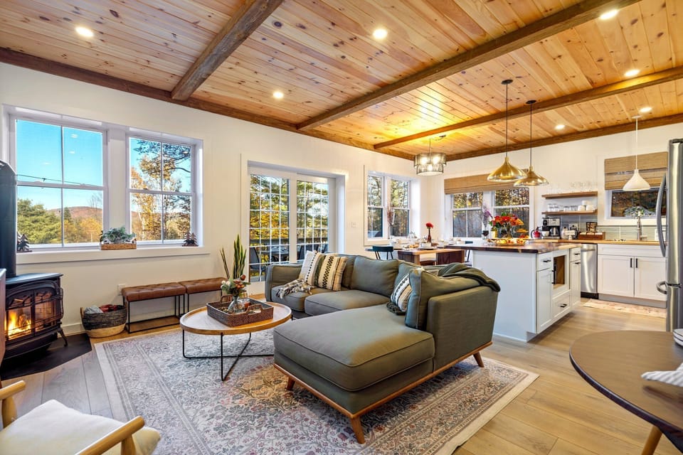 Relax by the fireplace in this beautifully designed open space.
