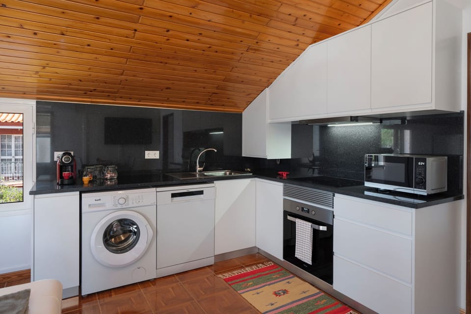 The Fully Equipped Kitchen Of Prazeres Paradise Apartment By Ourmadeira