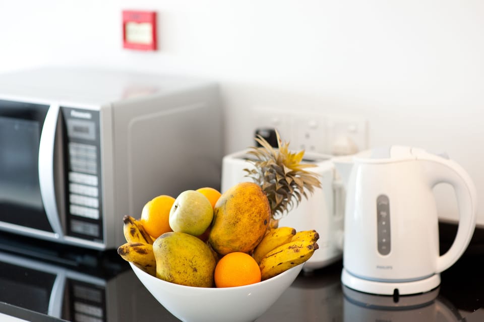 Mini-fridge, microwave, electric kettle, cookware/dishes/utensils