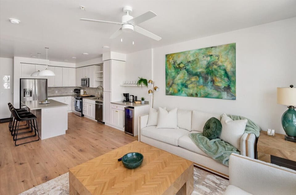 Capitol Building Views! Beautifully designed living room. 75` TV, comfy sofa and amazing views of mountains.
