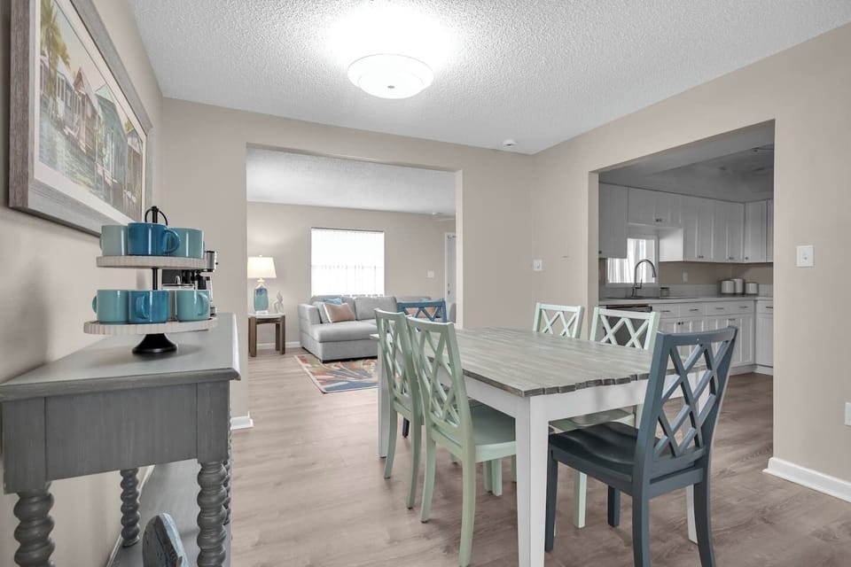 Dining area looking into back living room