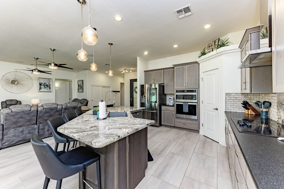 The open layout seamlessly connects to the living and dining areas