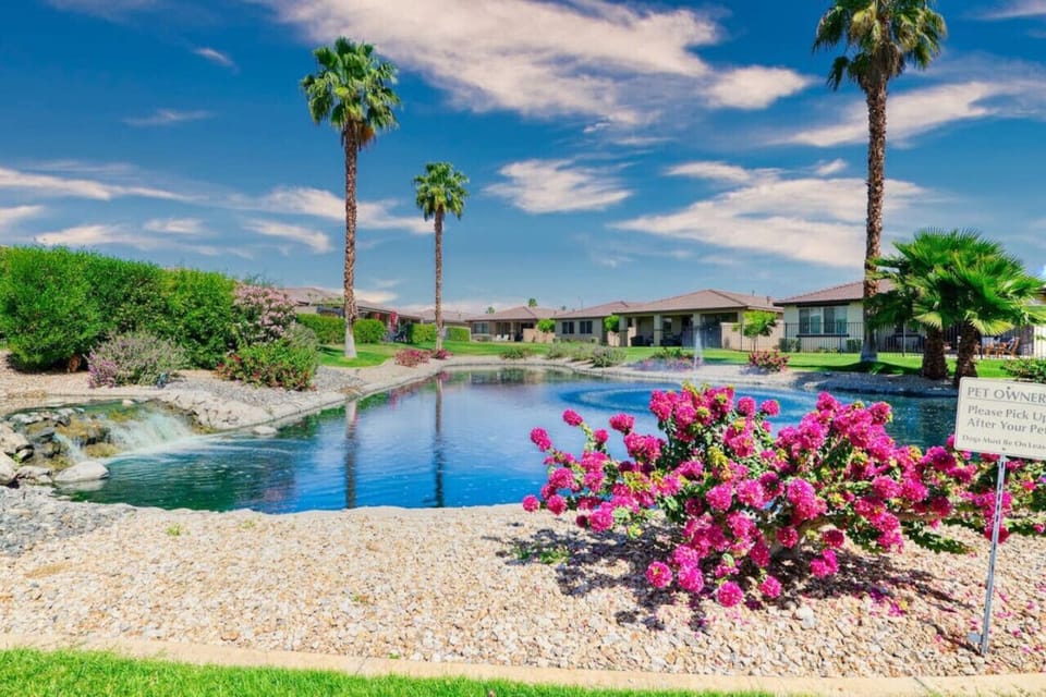Serene water features framed by colorful landscaping for a peaceful resort vibe.