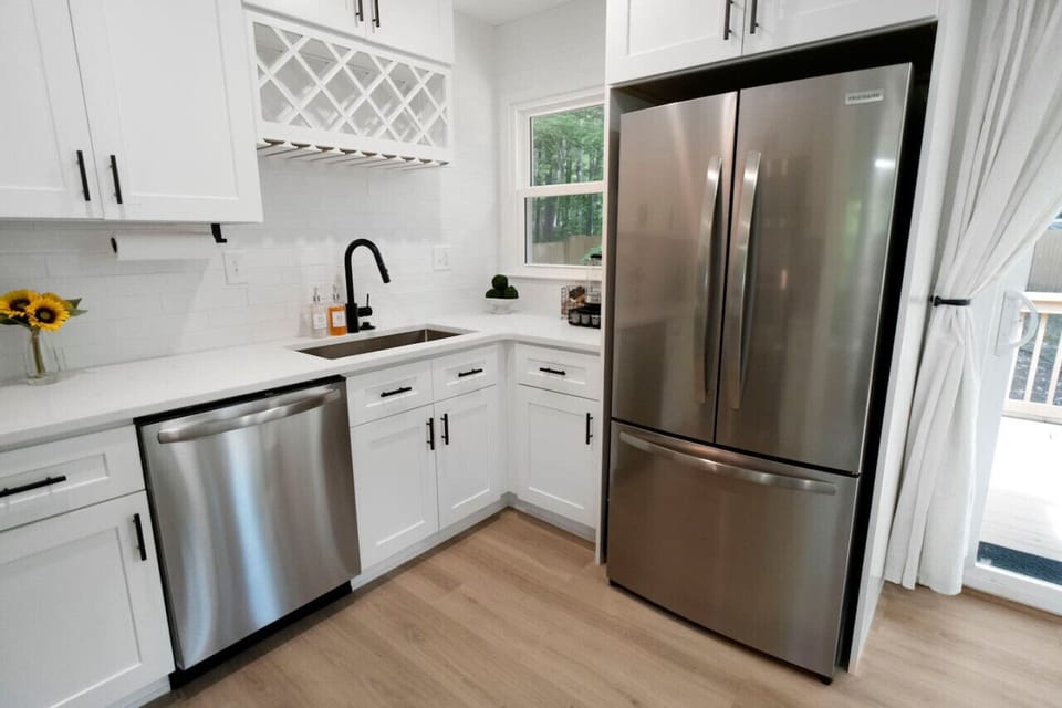 Bright kitchen w/ stainless appliances, crisp cabinetry, and everything needed for simple meals.