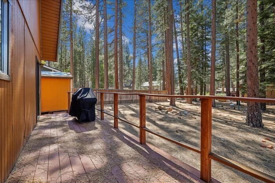 Relax on the spacious deck with a grill, perfect for outdoor dining and soaking in the forest.