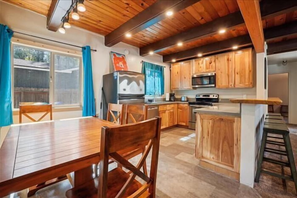 Fully equipped kitchen with rustic charm, ideal for home-cooked meals and cozy dining.