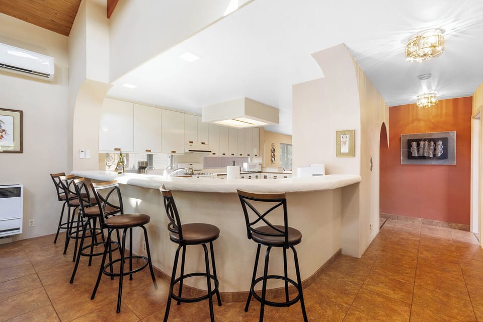 Its open concept makes it perfect for gathering, with bar seating available for 6
