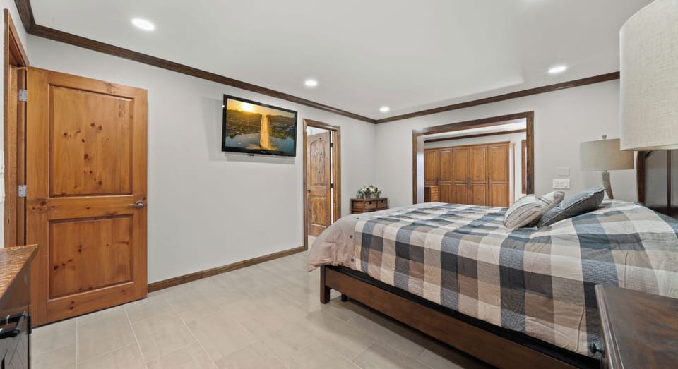 Master bedroom, private bath, walk-in closet, king bed and 55 inch TV