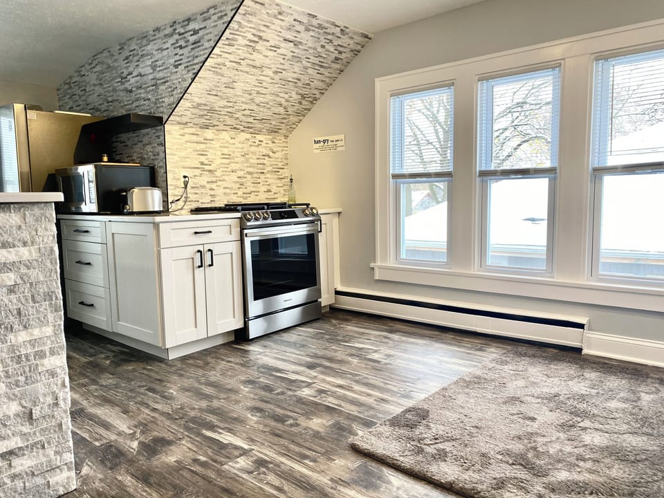Cook on a commercial gas range with provided cookware. Microwave for snacks, pots, and pans on the l