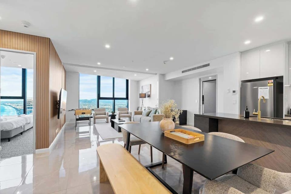 Enjoy meals with a view — dining area flows into the living room, with a rotatable TV for flexible viewing.