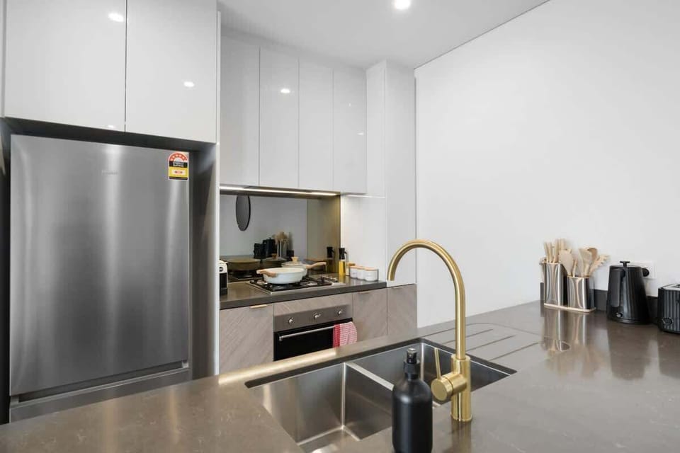 The kitchen is perfectly set up for family gatherings, featuring a kettle, toaster, coffee machine, and more