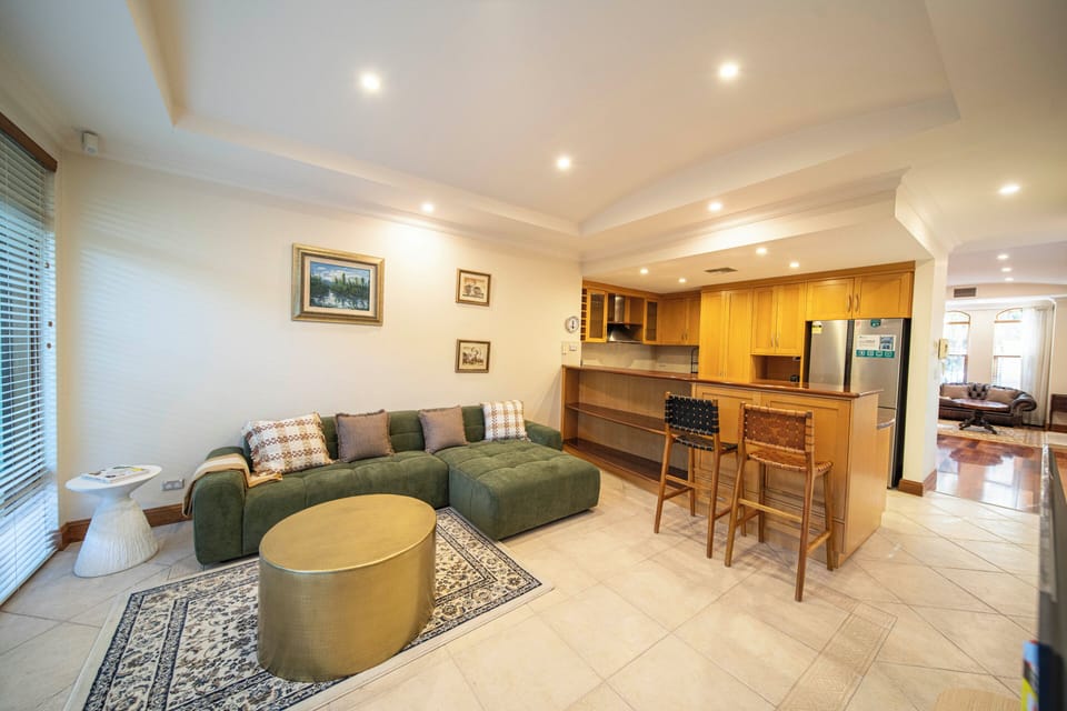 Economy Townhome, Balcony | Living area | TV, fireplace