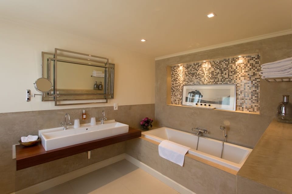 Superior Suite | Bathroom | Designer toiletries, hair dryer, bathrobes, slippers