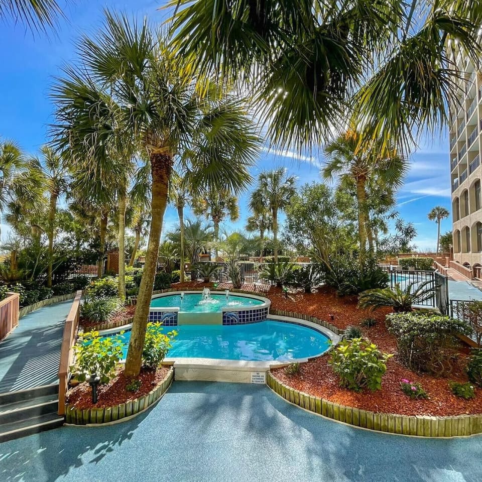 North Myrtle Beach`s premier tropically themed resort with fountains, tiki bar, palm trees, and an amazing view of the Atlantic Ocean.  Plenty of outdoor activity options, cabana options, and outdoor dining options with covered umbrellas and chairs.