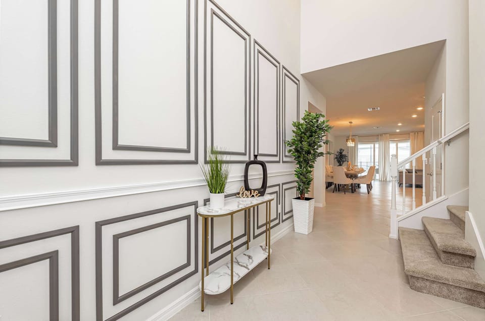 Step into a bright, stylish entryway that welcomes you into the home’s open living spaces.