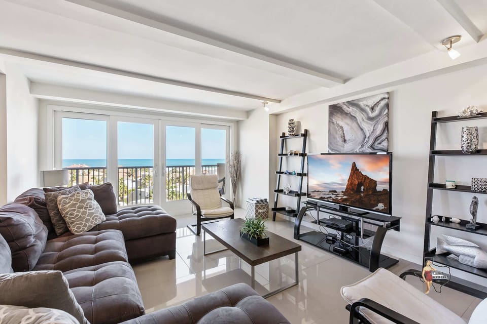Enjoy unparalleled ocean and city views from the comfort of this seating area.