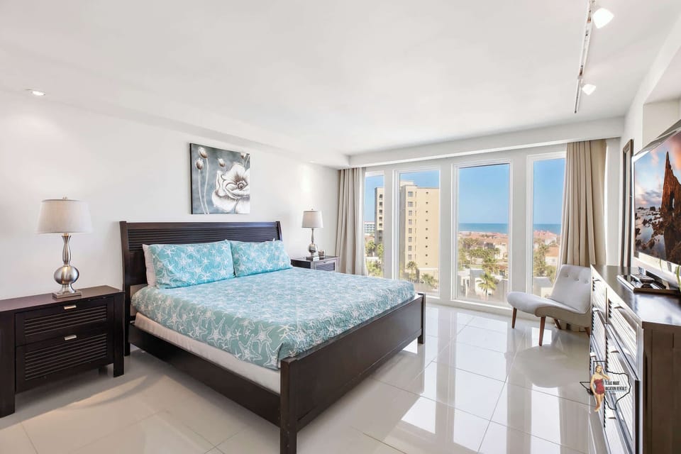 Bedroom 1 - A cozy bedroom with a king bed and panoramic ocean views.