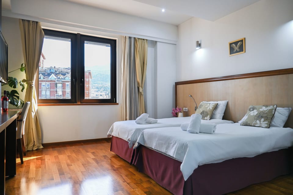 Double or Twin Room, City View | Blackout drapes, soundproofing, free WiFi