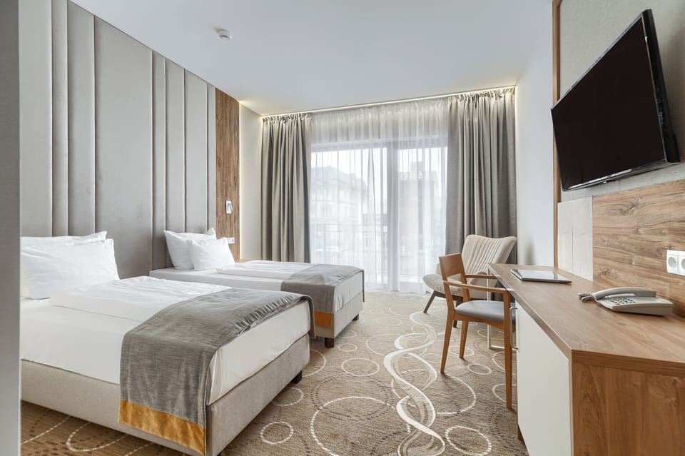 Deluxe Double or Twin Room, Balcony | In-room safe, desk, laptop workspace, cribs/infant beds