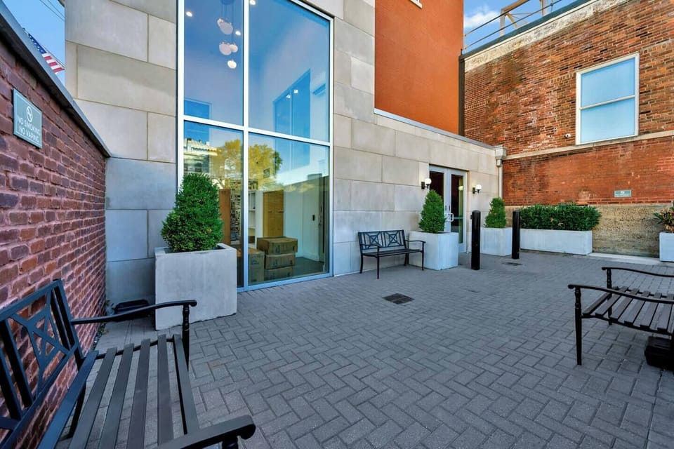 Exterior: Modern touches and historical architecture come together in the courtyard offering a welcoming outdoor space.