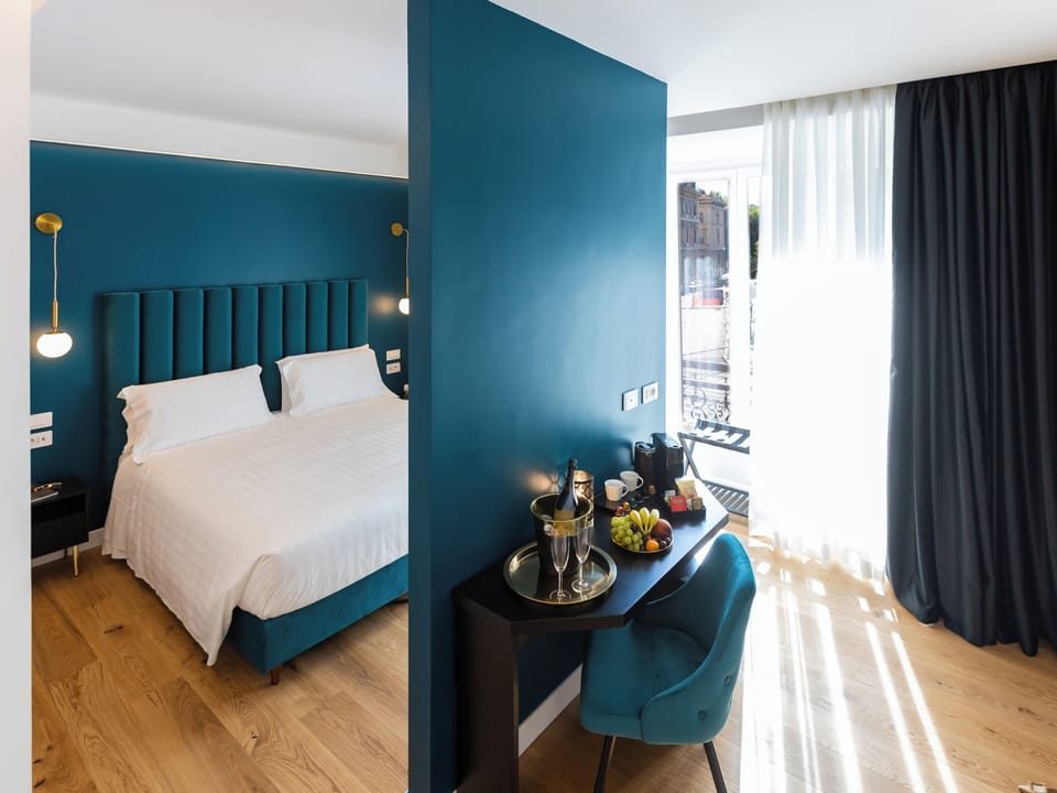 Queen Deluxe , River View | Minibar, in-room safe, desk, laptop workspace