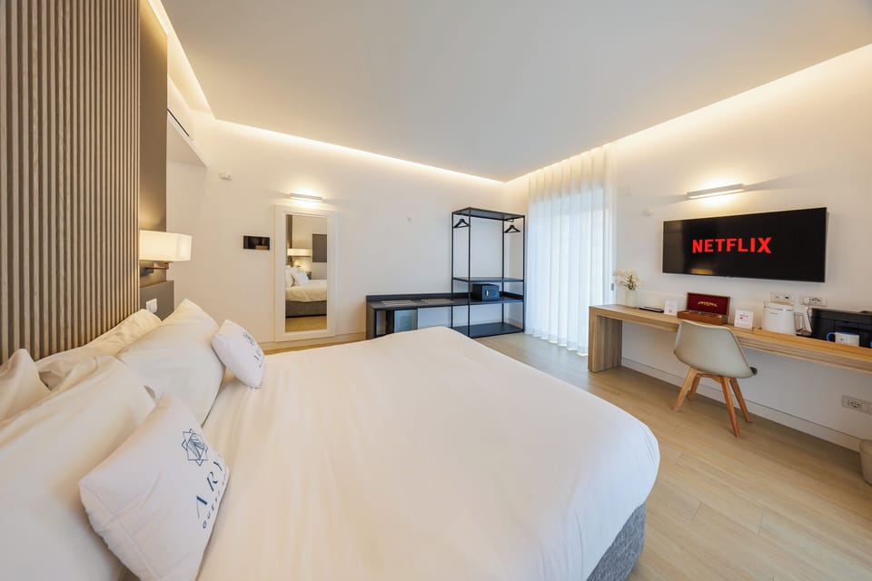 Deluxe Room, City View | In-room safe, desk, laptop workspace, blackout drapes