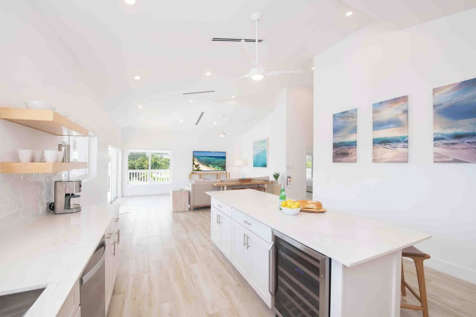 The kitchen comes equipped with a beverage fridge and a drip coffee machine. 