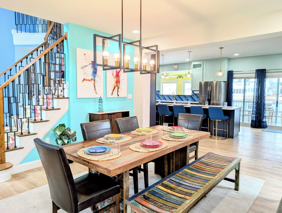 31311 May Drive, Bethany Lakes, Bethany Beach - Dining area - Bright dining room with a view of the staircase, highlighting the open-concept luxury layout.