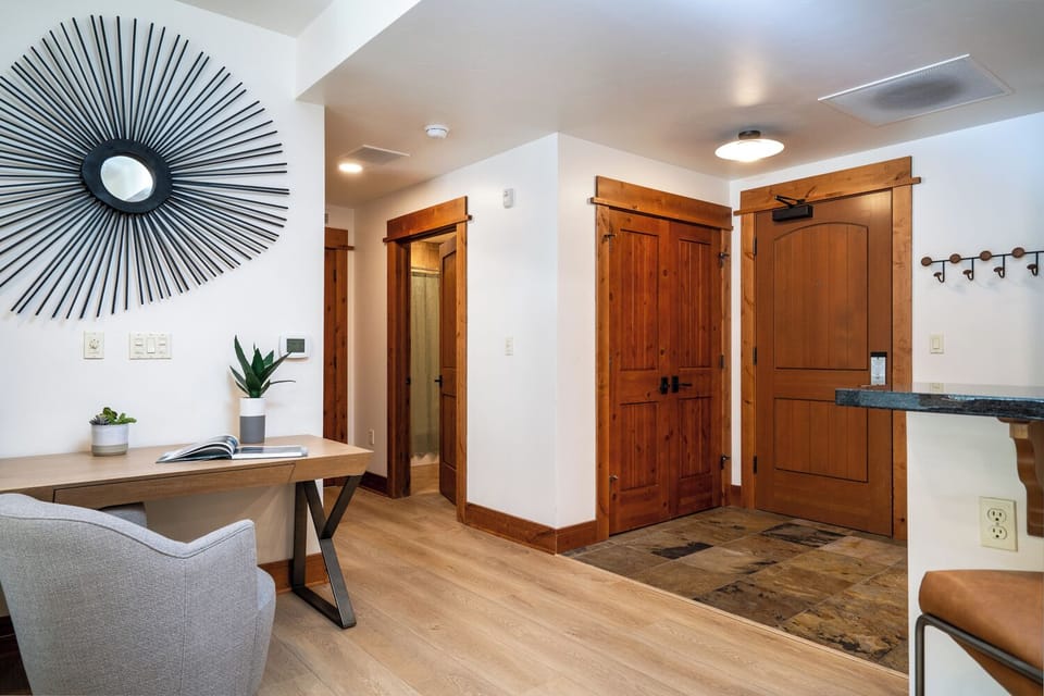 Entryway with closet and hooks to hang gear