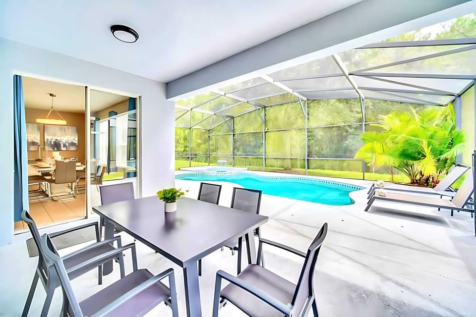 Poolside Dining Area With Table For Six And Shaded Comfort