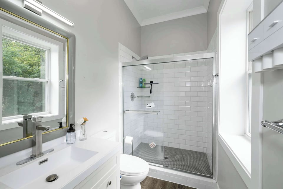 The 2nd bedroom en suite bath offers a single vanity & glass shower
