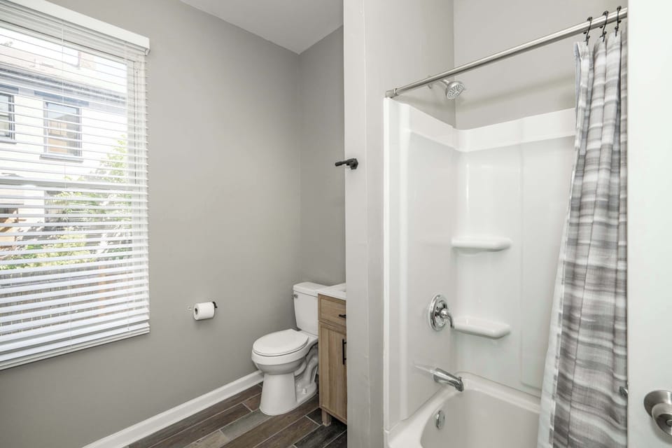 The 1st floor full bathroom offers a single vanity & shower/tub combo