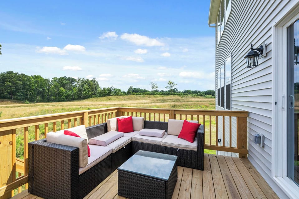 A cozy sofa and an expansive field view to enjoy your mornings or evenings