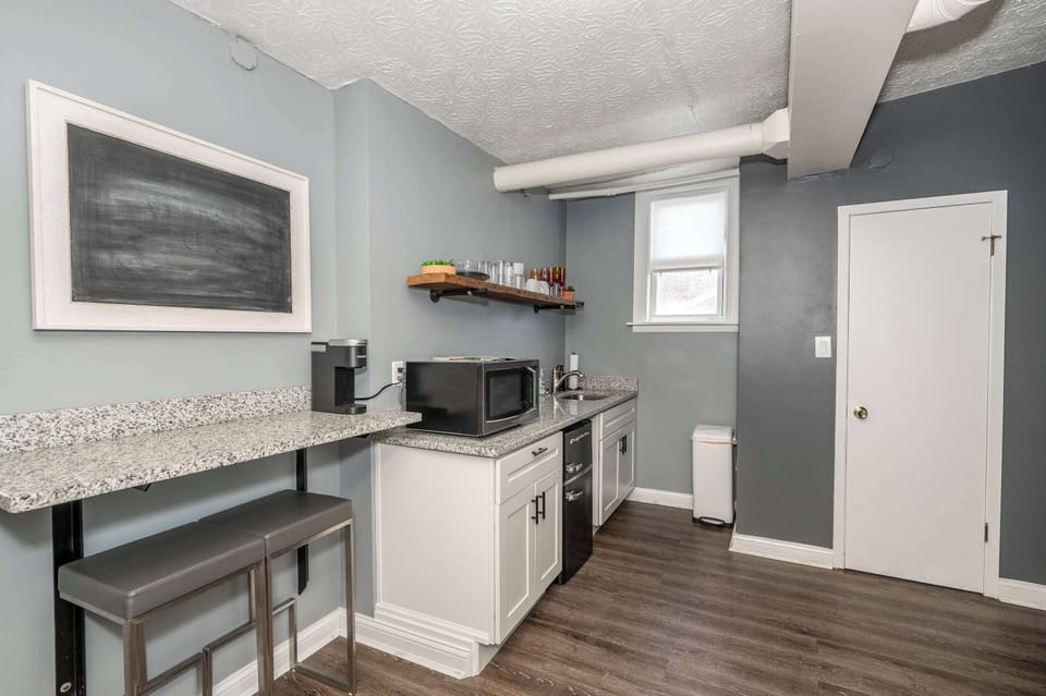 The streamlined kitchenette is well-equipped for your visit