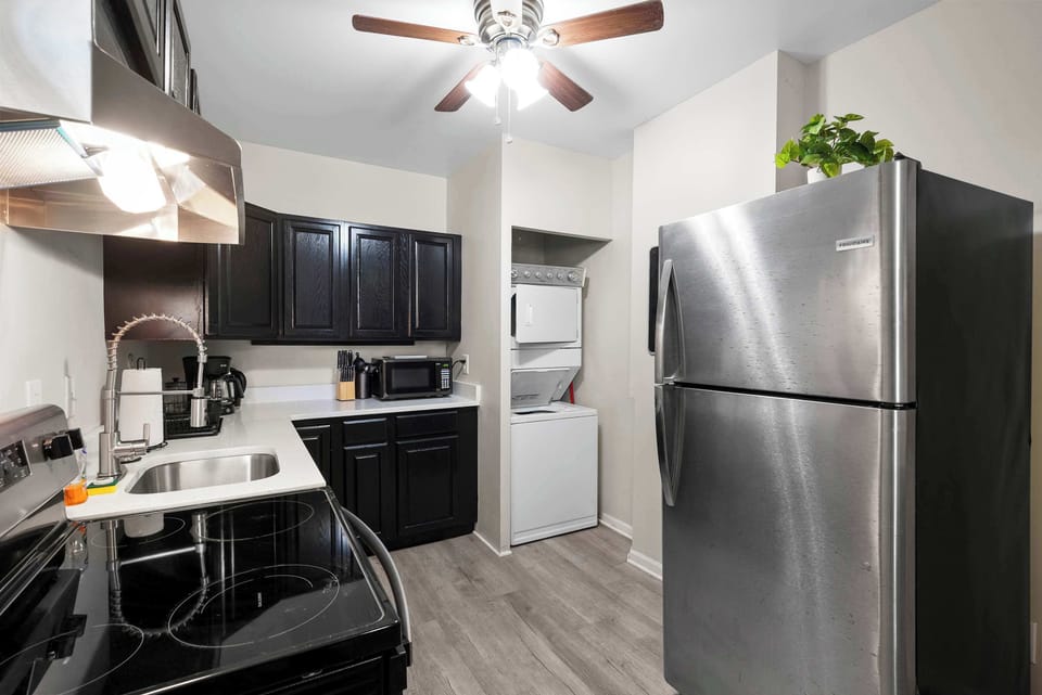 The sleek kitchen offers loads of storage space & every home comfort