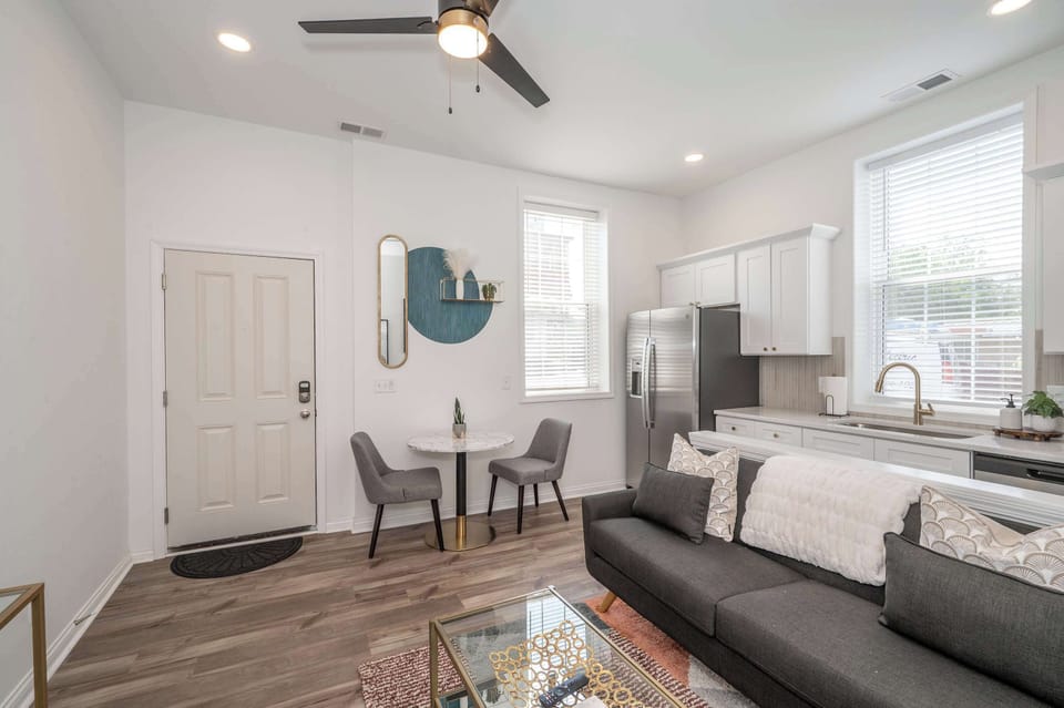 Unit 201: Enjoy the bright, airy living area with dining seating for 2