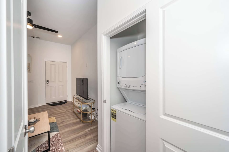 Private laundry is neatly tucked away in the hall closet