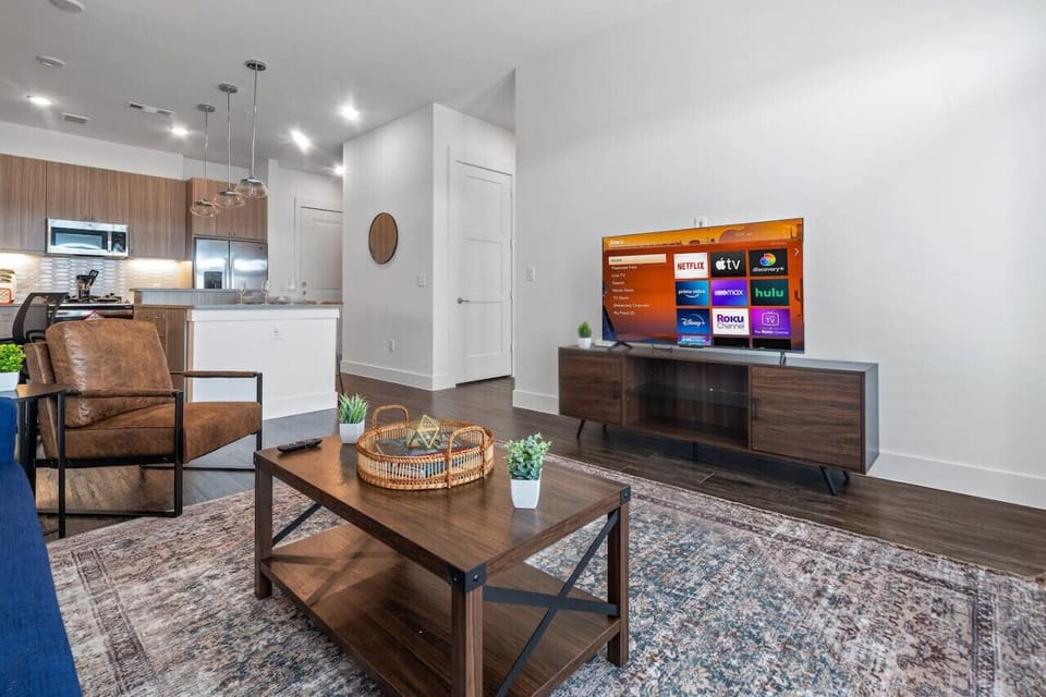 As you take a seat in the living room, the comfortable furniture and tasteful design make it easy to unwind.
