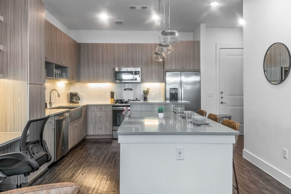 As you open the kitchen, you discover an assortment of coffee pods, and sugar, ensuring you have everything you need for a perfect morning or afternoon pick-me-up.