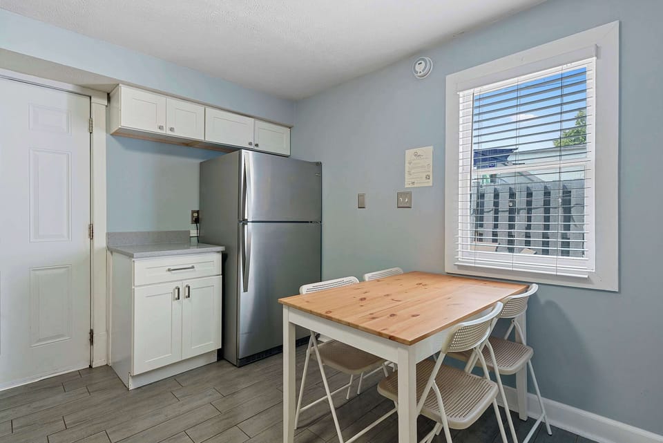 The airy eat-in kitchen offers ample space & all the comforts of home