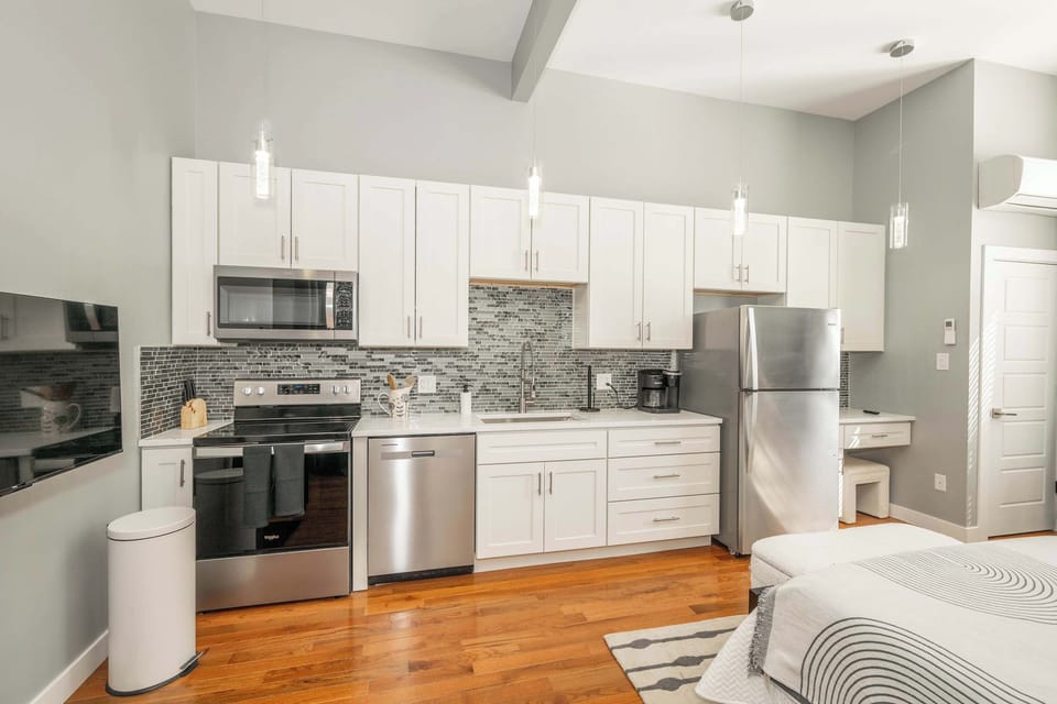 Relax with your favorite streaming in this chic studio’s plush queen-sized bed