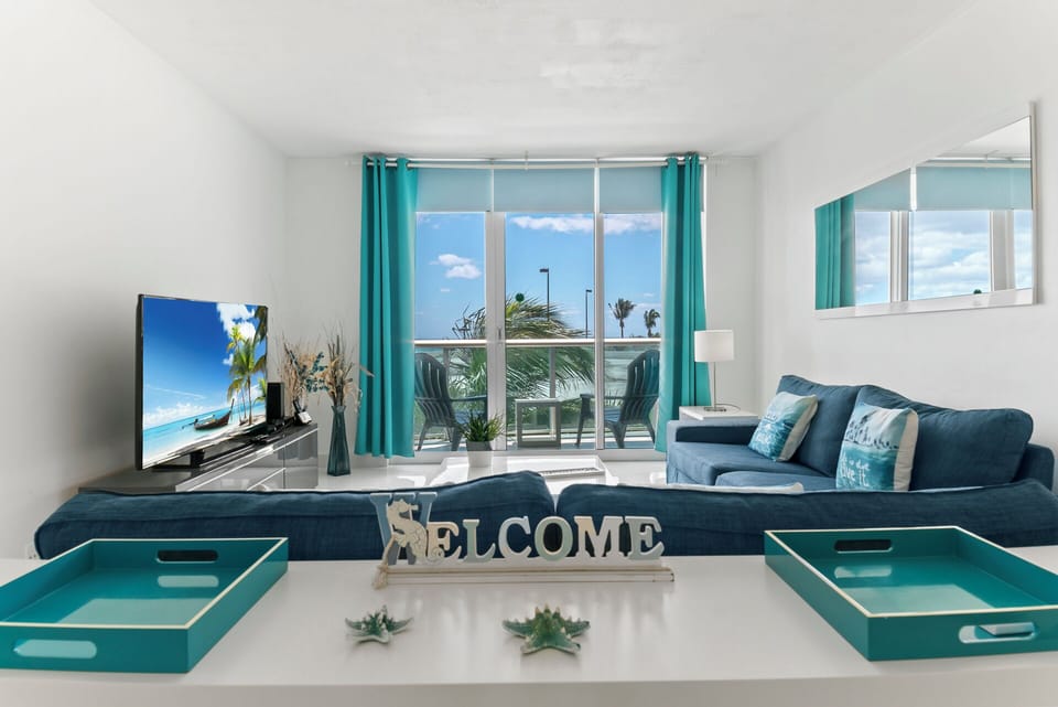 Bright living space with ample seating and TV