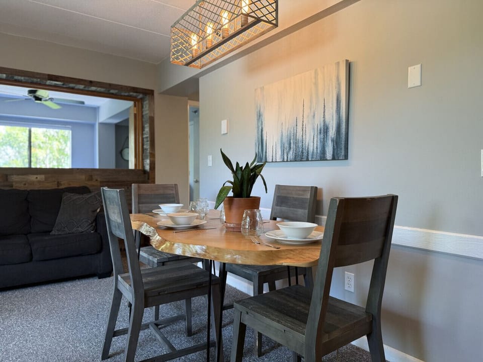 Gather around the beautiful wooden dining table for meals