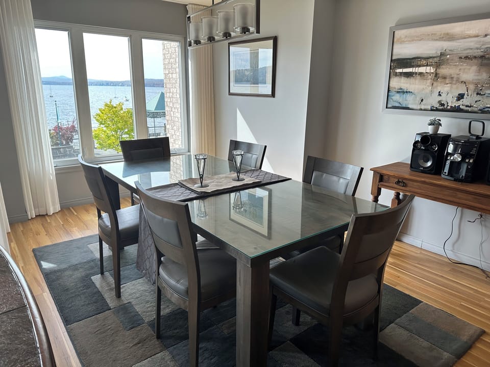 Condo, Balcony, Lake View | Living area | 54-inch TV with cable channels