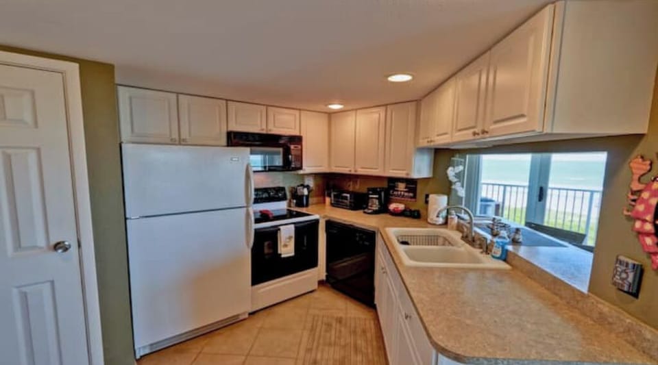 stovetop, indoor, refrigerator, coffee maker, oven, kitchen, microwave