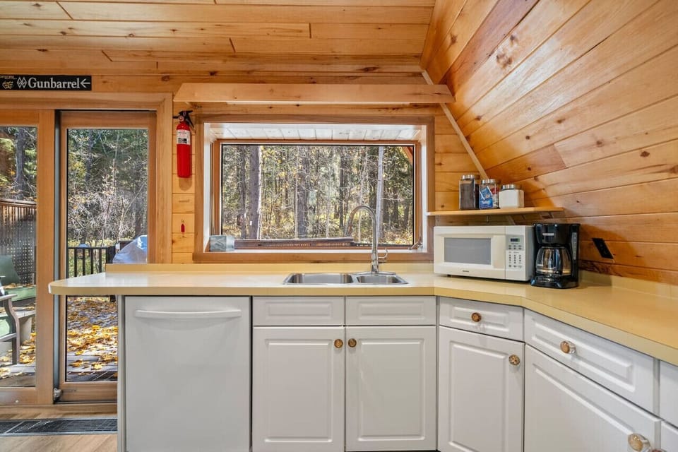 Full kitchen with a drip coffee maker, blender, crockpot, electric griddle & a panini press.