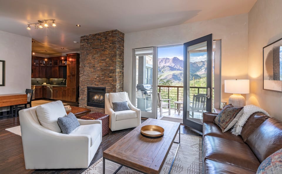 Living room summer views - unobstructed mountain views of the San Sophia ridgeline