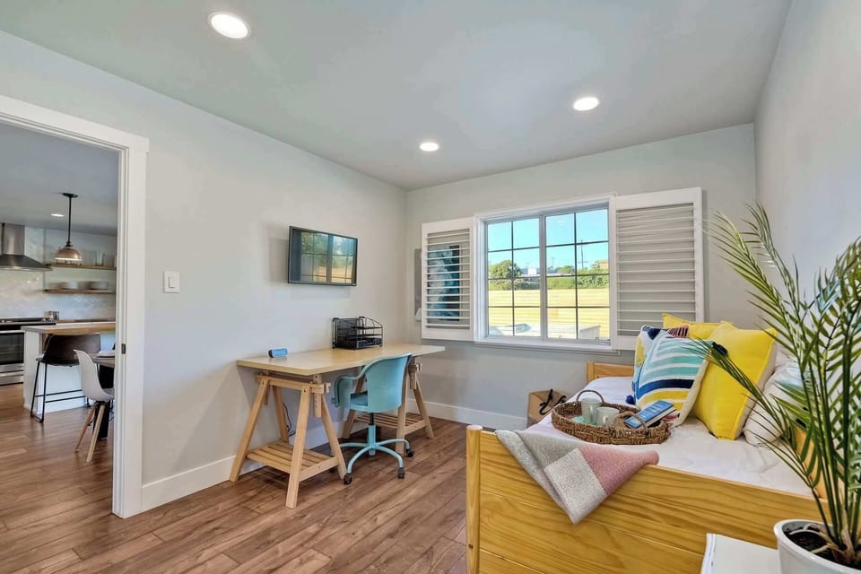 The third bedroom offers a twin daybed with twin trundle & desk workspace