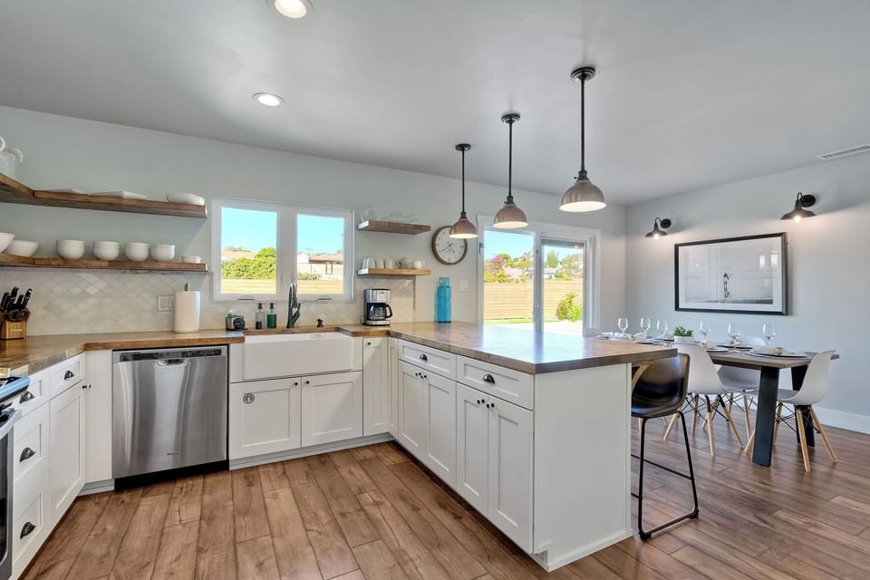 The airy kitchen is spacious & offers all the comforts of home
