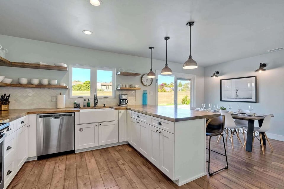 The airy kitchen is spacious & offers all the comforts of home